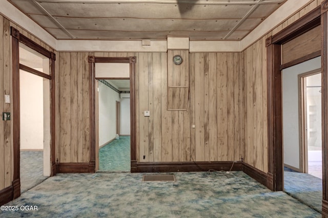 302 E Market St, Diamond, MO 64840 - unfurnished room featuring carpet floors and wooden walls