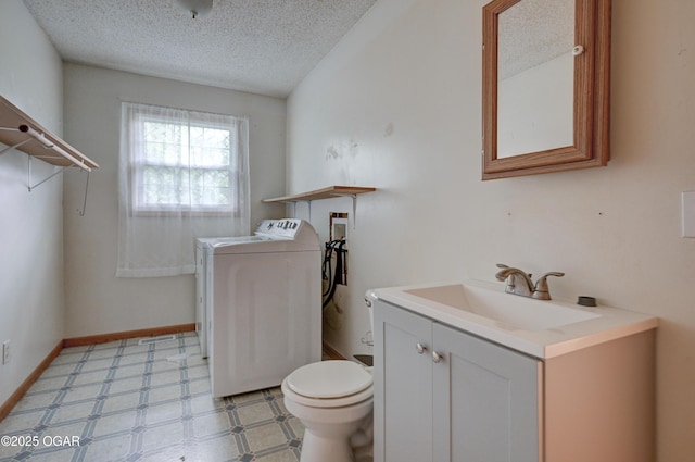 302 E Market St, Diamond, MO 64840 - half bathroom featuring washer / clothes dryer, a textured ceiling, vanity, and tile patterned floors