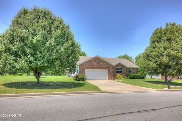 3024 N Chandler Ave, Joplin, MO 64801 - single story home featuring brick siding, a front yard, a garage, and driveway