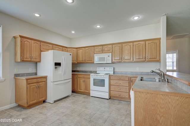 3024 N Chandler Ave, Joplin, MO 64801 - kitchen with white appliances, a peninsula, recessed lighting, light countertops, and light tile patterned flooring
