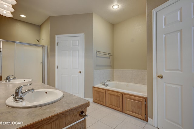 3024 N Chandler Ave, Joplin, MO 64801 - full bathroom with tile patterned floors, a shower stall, a garden tub, double vanity, and recessed lighting