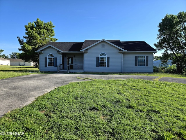 3511 Nola Dr, Joplin, MO 64801 - single story home featuring a porch, asphalt driveway, and a front yard