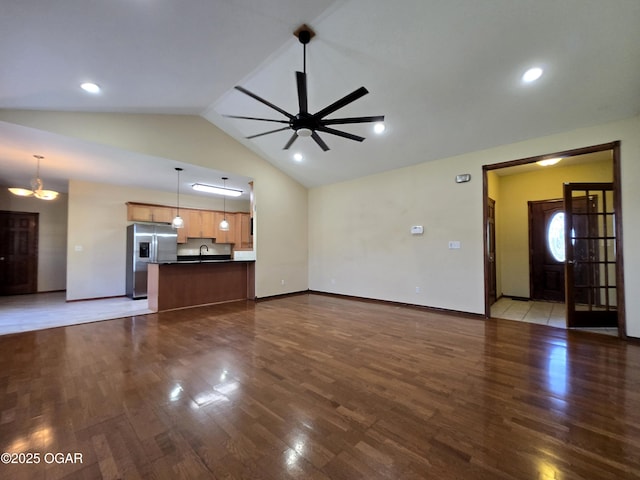 3511 Nola Dr, Joplin, MO 64801 - unfurnished living room featuring dark wood-type flooring, a ceiling fan, and high vaulted ceiling