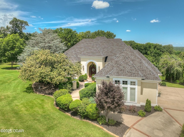 5738 Deer Park Ln, Joplin, MO 64804 - view of front of property featuring stucco siding, a front lawn, and roof with shingles