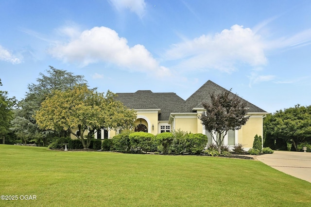 5738 Deer Park Ln, Joplin, MO 64804 - view of front of property with stucco siding, a front yard, and roof with shingles