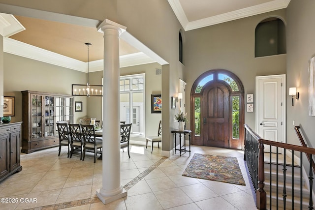 5738 Deer Park Ln, Joplin, MO 64804 - entryway featuring a high ceiling, light tile patterned floors, ornamental molding, a chandelier, and ornate columns