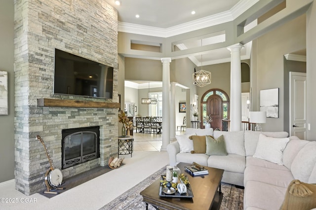 5738 Deer Park Ln, Joplin, MO 64804 - carpeted living area featuring a towering ceiling, a fireplace, crown molding, ornate columns, and recessed lighting