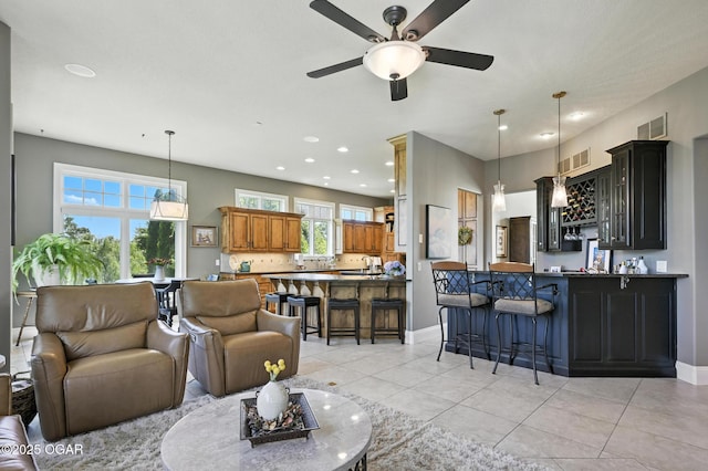 5738 Deer Park Ln, Joplin, MO 64804 - living room with a ceiling fan, recessed lighting, and light tile patterned floors