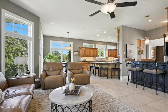5738 Deer Park Ln, Joplin, MO 64804 - living area with plenty of natural light, light tile patterned flooring, a ceiling fan, and recessed lighting