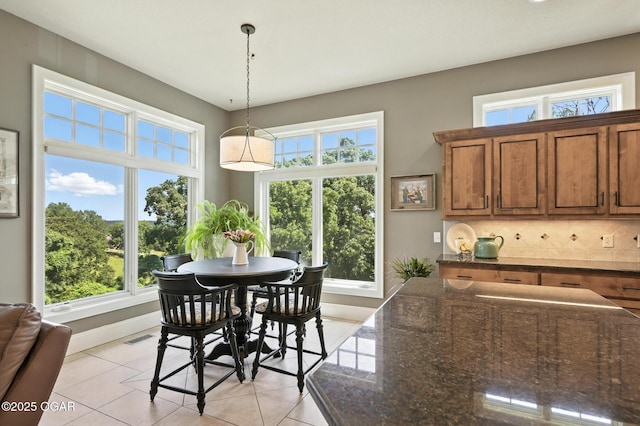 5738 Deer Park Ln, Joplin, MO 64804 - dining room with plenty of natural light and light tile patterned floors