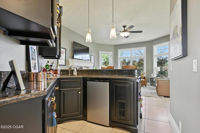 5738 Deer Park Ln, Joplin, MO 64804 - kitchen with dishwasher, a peninsula, ceiling fan, and light tile patterned floors