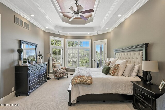 5738 Deer Park Ln, Joplin, MO 64804 - carpeted bedroom featuring access to exterior, ornamental molding, a tray ceiling, recessed lighting, and a ceiling fan