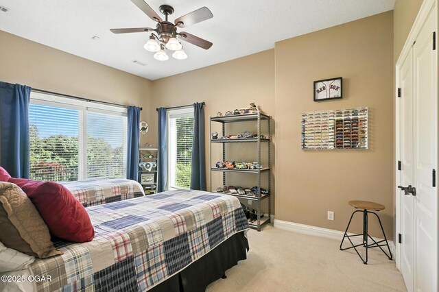 5738 Deer Park Ln, Joplin, MO 64804 - bedroom with light colored carpet, a closet, and ceiling fan
