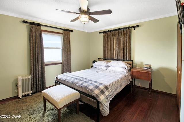 3508 Dirr Ave, Parsons, KS 67357 - bedroom with radiator, crown molding, wood finished floors, and a ceiling fan