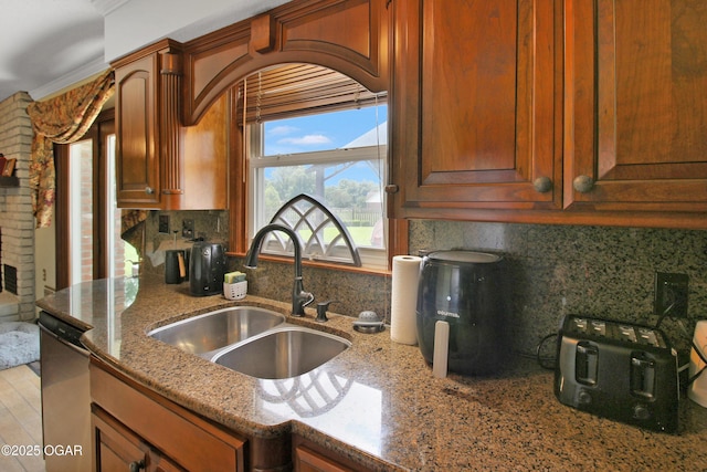 3508 Dirr Ave, Parsons, KS 67357 - kitchen with dishwasher, light stone counters, and tasteful backsplash