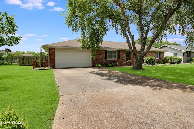 3508 Dirr Ave, Parsons, KS 67357 - single story home with concrete driveway, a garage, and brick siding