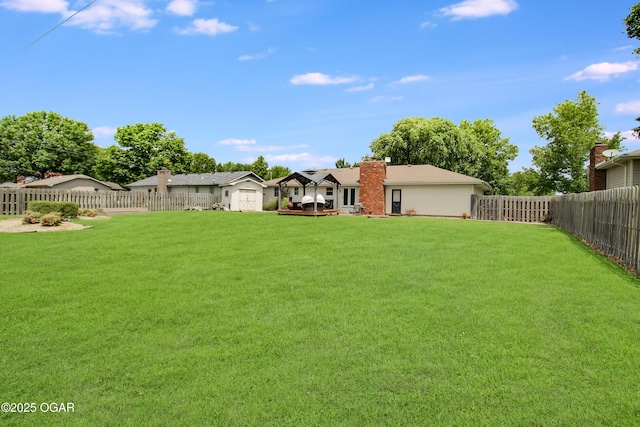 3508 Dirr Ave, Parsons, KS 67357 - fenced backyard featuring a storage shed