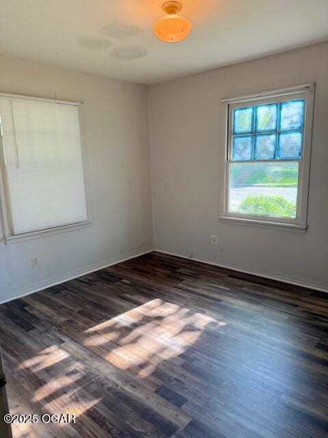 1705 S Walnut St, Pittsburg, KS 66762 - empty room featuring wood finished floors and baseboards