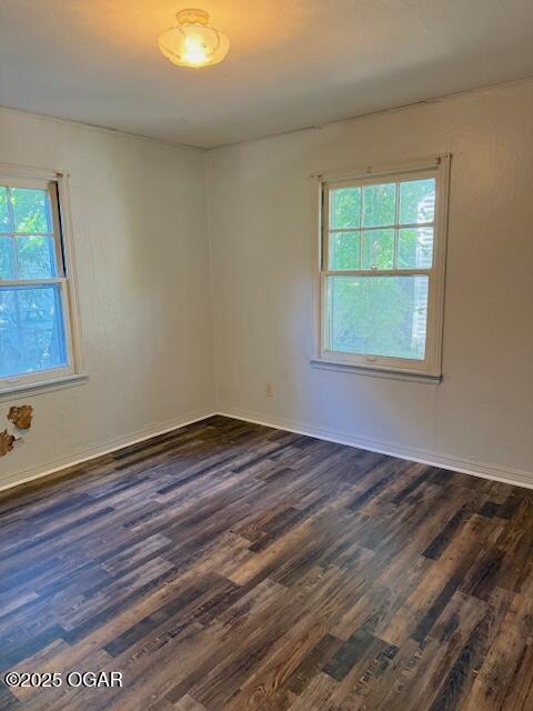 1705 S Walnut St, Pittsburg, KS 66762 - spare room with dark wood-style flooring