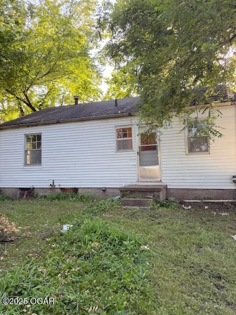 1705 S Walnut St, Pittsburg, KS 66762 - rear view of house with entry steps and crawl space