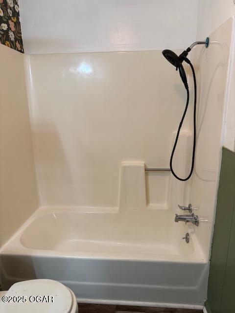1705 S Walnut St, Pittsburg, KS 66762 - bathroom featuring toilet and  shower combination