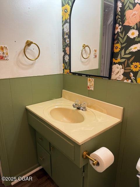 1705 S Walnut St, Pittsburg, KS 66762 - half bathroom with vanity and a wainscoted wall