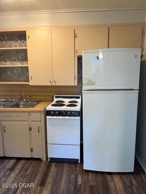 1705 S Walnut St, Pittsburg, KS 66762 - kitchen with white appliances, dark wood-style flooring, light countertops, and open shelves
