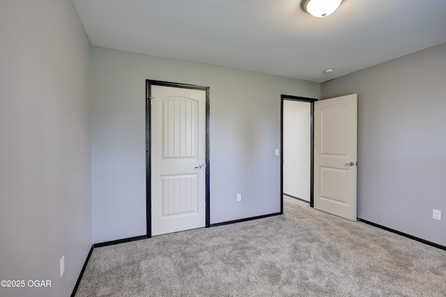 2036 S Ozark, Joplin, MO 64804 - unfurnished bedroom featuring carpet floors and baseboards