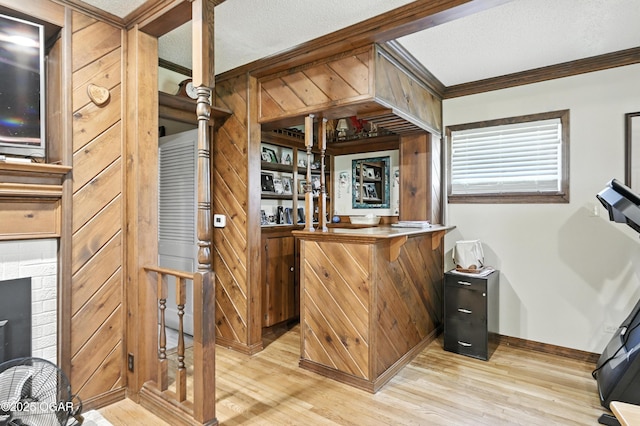25327 Central Ave, Joplin, MO 64801 - indoor dry bar with light wood-type flooring and crown molding