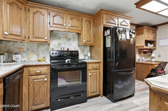 25327 Central Ave, Joplin, MO 64801 - kitchen with black appliances, light wood-type flooring, backsplash, and brown cabinetry