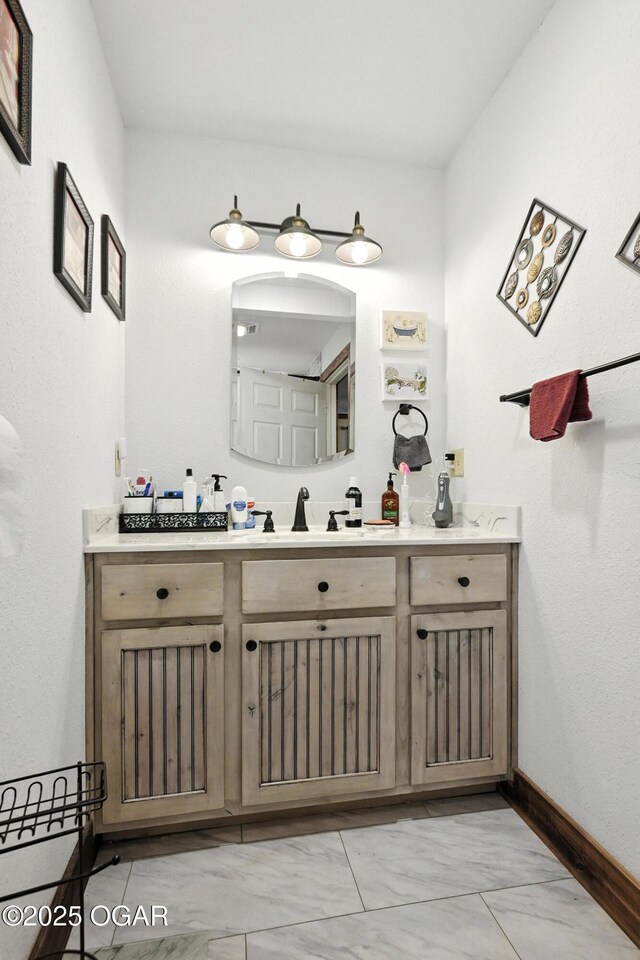 25327 Central Ave, Joplin, MO 64801 - bathroom with vanity and marble look tiles
