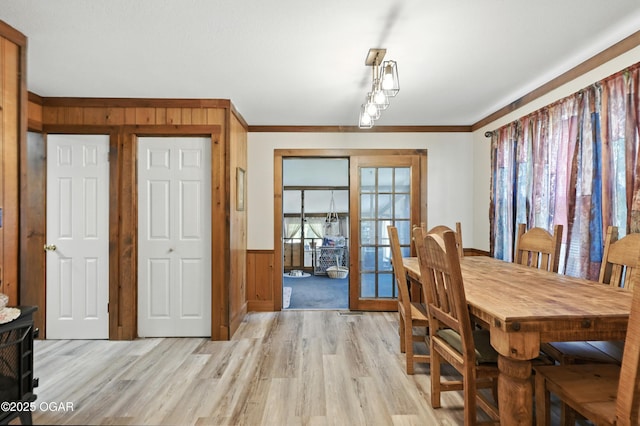 25327 Central Ave, Joplin, MO 64801 - dining space with light wood-style floors, wainscoting, plenty of natural light, ornamental molding, and wood walls