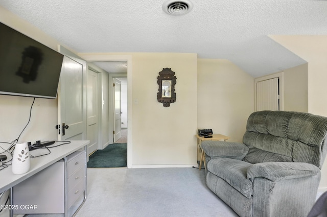 25327 Central Ave, Joplin, MO 64801 - living area with light carpet, a textured ceiling, and vaulted ceiling