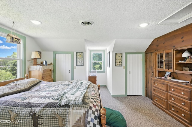 25327 Central Ave, Joplin, MO 64801 - carpeted bedroom with a textured ceiling, vaulted ceiling, multiple windows, and recessed lighting