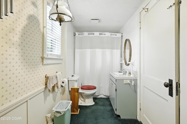 25327 Central Ave, Joplin, MO 64801 - full bathroom with vanity, wallpapered walls, wainscoting, curtained shower, and a textured ceiling