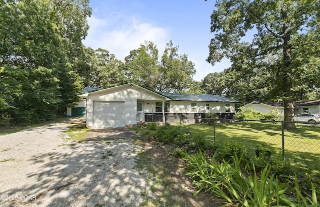 137 Lone Elm Dr, Carl Junction, MO 64834 - view of front facade featuring a garage and gravel driveway