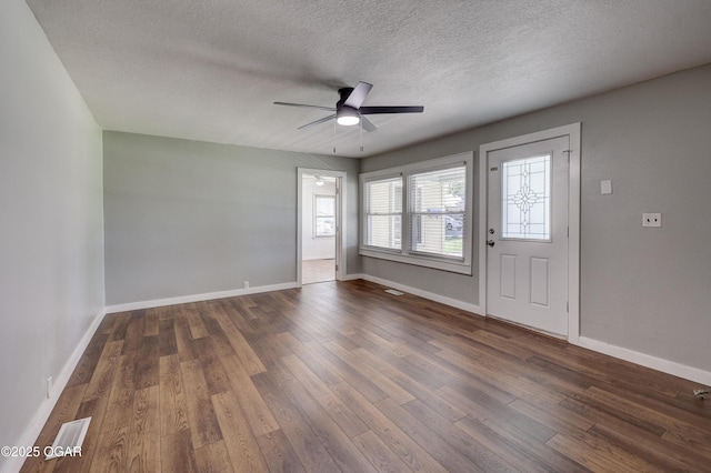 605 S Jefferson St, Webb City, MO 64870 - foyer featuring a ceiling fan, dark wood-style flooring, and a textured ceiling
