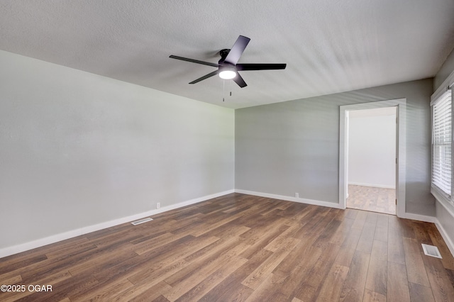 605 S Jefferson St, Webb City, MO 64870 - empty room with a ceiling fan and dark wood-style flooring