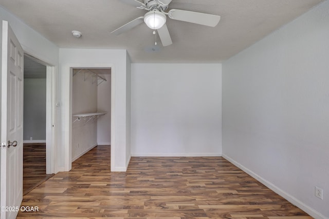 605 S Jefferson St, Webb City, MO 64870 - unfurnished bedroom with wood finished floors, a closet, and a ceiling fan