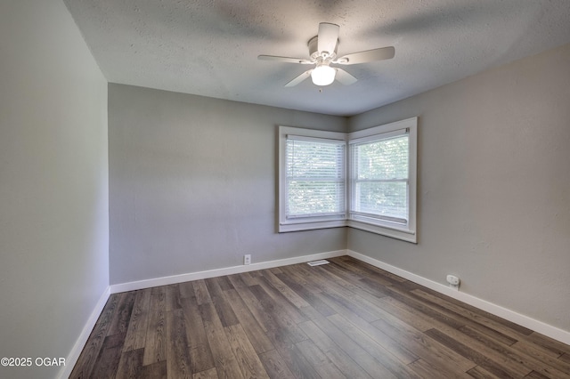 605 S Jefferson St, Webb City, MO 64870 - empty room featuring dark wood-style flooring, ceiling fan, and a textured ceiling