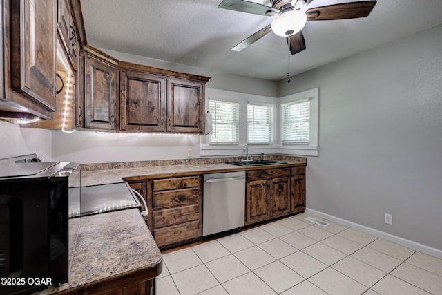 605 S Jefferson St, Webb City, MO 64870 - kitchen with dishwasher, a ceiling fan, light countertops, dark brown cabinets, and light tile patterned floors