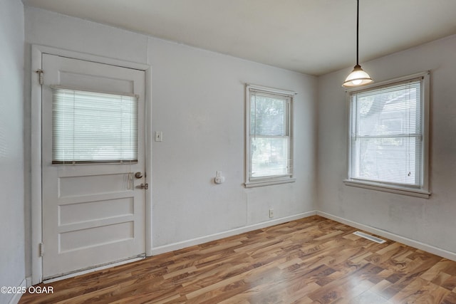 605 S Jefferson St, Webb City, MO 64870 - unfurnished dining area with light wood-style floors