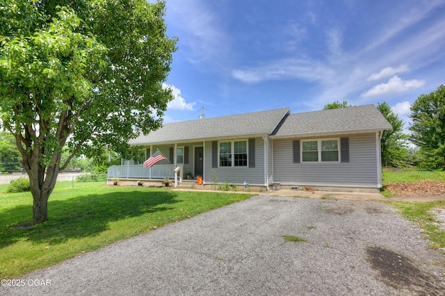 1501 Ryan Rd, Joplin, MO 64801 - ranch-style house featuring covered porch, a front yard, and roof with shingles