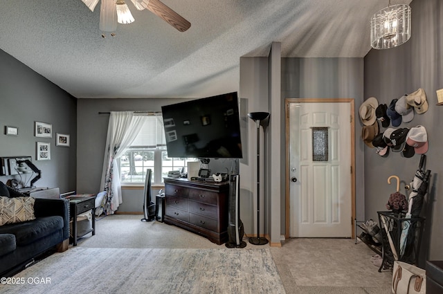 1501 Ryan Rd, Joplin, MO 64801 - living area featuring a ceiling fan, a textured ceiling, and a chandelier
