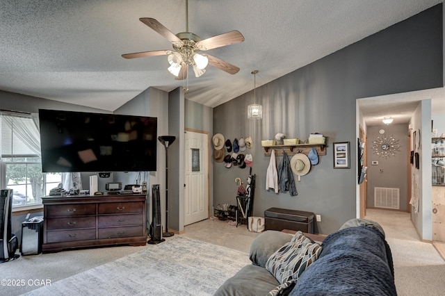 1501 Ryan Rd, Joplin, MO 64801 - carpeted living area with vaulted ceiling, a ceiling fan, and a textured ceiling