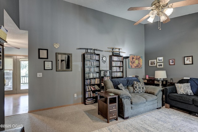 1501 Ryan Rd, Joplin, MO 64801 - living room with high vaulted ceiling, ceiling fan, light colored carpet, and a textured ceiling