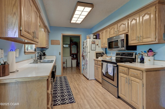 1501 Ryan Rd, Joplin, MO 64801 - kitchen with stainless steel appliances, light countertops, and light wood-type flooring
