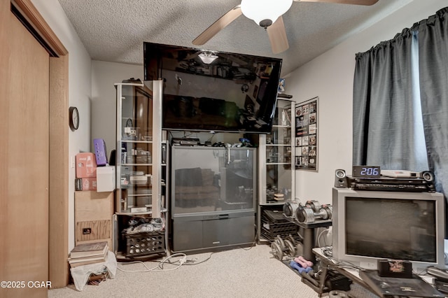 1501 Ryan Rd, Joplin, MO 64801 - carpeted living room featuring a ceiling fan and a textured ceiling