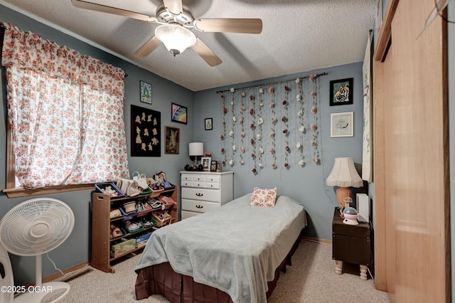 1501 Ryan Rd, Joplin, MO 64801 - carpeted bedroom with a textured ceiling and ceiling fan
