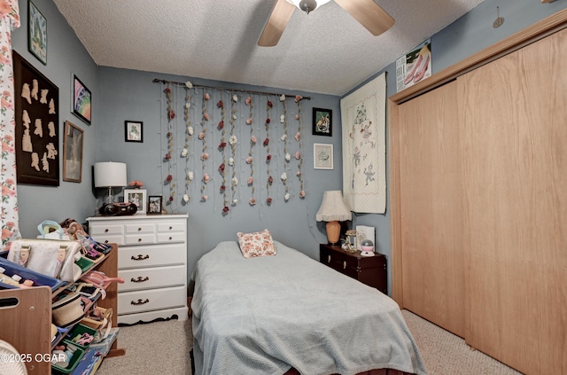 1501 Ryan Rd, Joplin, MO 64801 - bedroom featuring carpet flooring, a textured ceiling, a closet, and ceiling fan